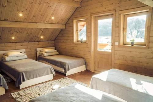 Ένα ή περισσότερα κρεβάτια σε δωμάτιο στο Pas Rimute