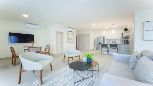 a living room with a couch and chairs and a table at Executive Rental Studio w Skyline Views in Panama in Panama City