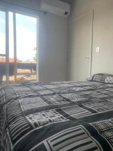 Ένα ή περισσότερα κρεβάτια σε δωμάτιο στο Casa nos fundos dois quartos em Itajai