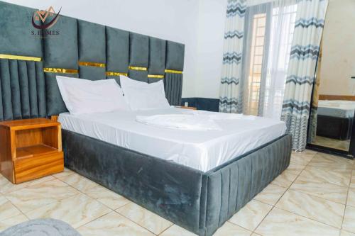 Ένα ή περισσότερα κρεβάτια σε δωμάτιο στο Siri's Home