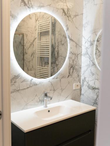 a bathroom with a sink and a mirror at VILLA ISABELLA Ospedale Cisanello in Pisa