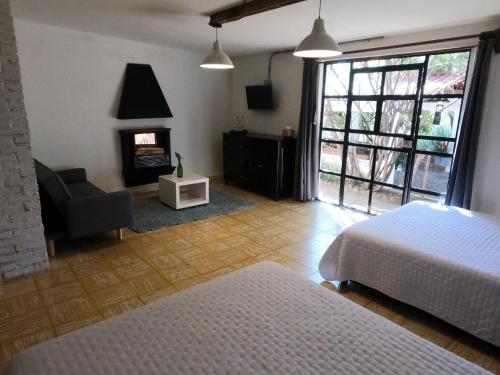 Giường trong phòng chung tại Finca del Pomar