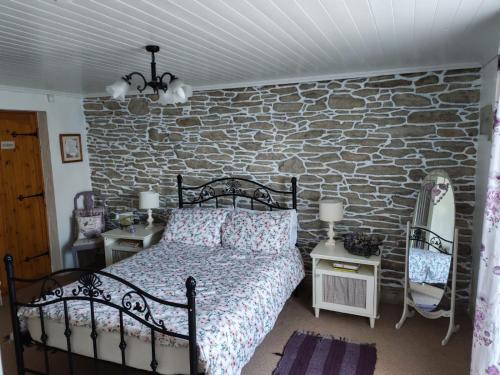 Ένα ή περισσότερα κρεβάτια σε δωμάτιο στο Carnowen Cottage