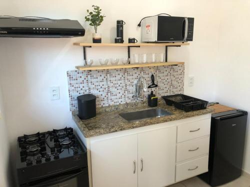 Kuchyň nebo kuchyňský kout v ubytování Kitnet em Araras