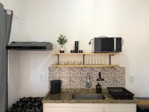 Kuchyň nebo kuchyňský kout v ubytování Kitnet em Araras