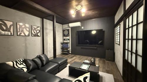 TV a/nebo společenská místnost v ubytování 一棟貸し宿 ｍａｉｃｃａ