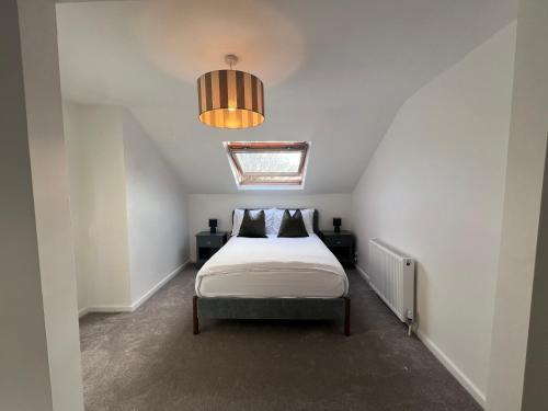 a bedroom with a bed and a ceiling at The Bluebird Rooms III in Central Station