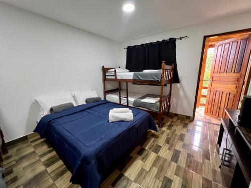 Ένα ή περισσότερα κρεβάτια σε δωμάτιο στο Pousada Paraíso do Peró