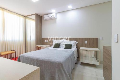 Giường trong phòng chung tại Lindo sobrado localizado a 4 minutos do autodromo de Goiânia