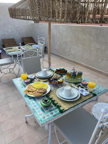 a table with food on top of it at Riad Lalla Fatima Marrakech in Marrakesh