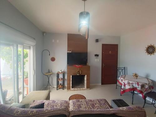 Et opholdsområde på Casa Cassino com Piscina