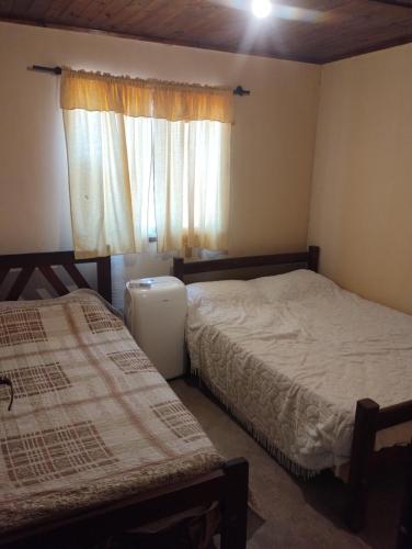 Ένα ή περισσότερα κρεβάτια σε δωμάτιο στο Finca Juramento II
