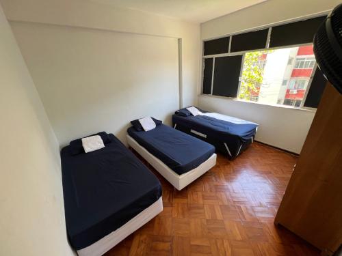 En eller flere senge i et værelse på Quarto na Pituba