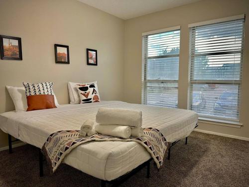 a bedroom with a large bed and a window at KINGbed A plus location A plus for workers LongStayDiscount in Sherman