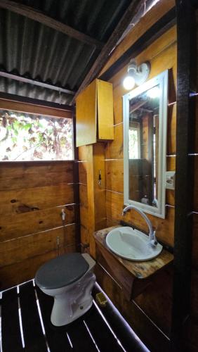 a bathroom with a sink and a toilet at Plancton House Atins in Atins