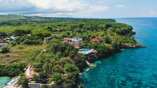 an aerial view of a house on an island in the ocean at Sacaan Tropical Breeze Resort in Sogod