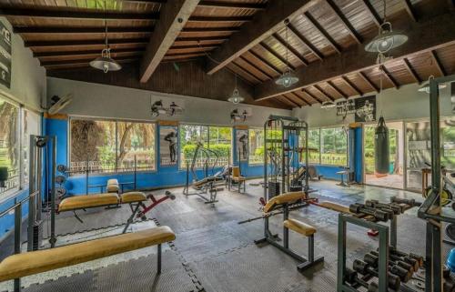 a gym with several exercise equipment in a room at Allá en el sur Canning in Ezeiza