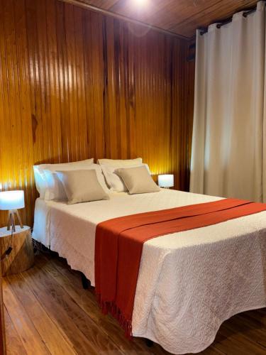 Ένα ή περισσότερα κρεβάτια σε δωμάτιο στο Recanto Bellagio