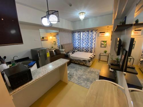 a small living room with a couch and a living room at Avida Tower 1 in Cagayan de Oro