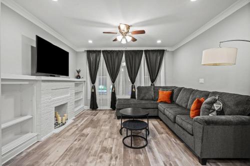 a living room with a couch and a fireplace at Little India Gem - Bollywood Retreat Near Markets in Chicago
