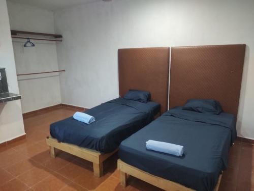 En eller flere senge i et værelse på Jardines del Mar by La Cultura Suites - Boutique Studios Playa del Carmen