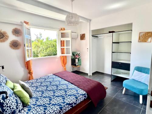 Postel nebo postele na pokoji v ubytování Villa Anj'any DESHAIES - 400 m à pied de la plage de Grande Anse