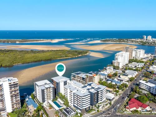 an aerial view of a city with a beach and buildings at Avalon Resort Maroochydore in Maroochydore