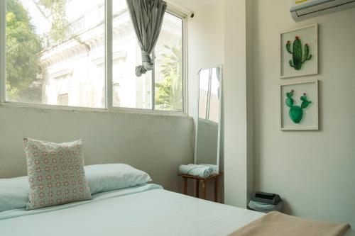 Postel nebo postele na pokoji v ubytování MANGO BiCHE - HOUSE