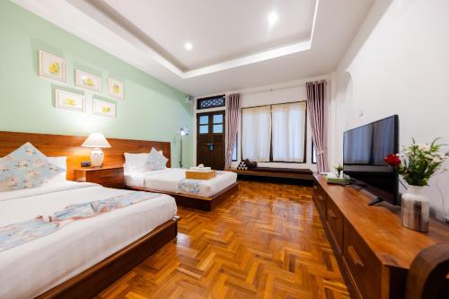 Voodi või voodid majutusasutuse Teewana Resort ChiangMai toas