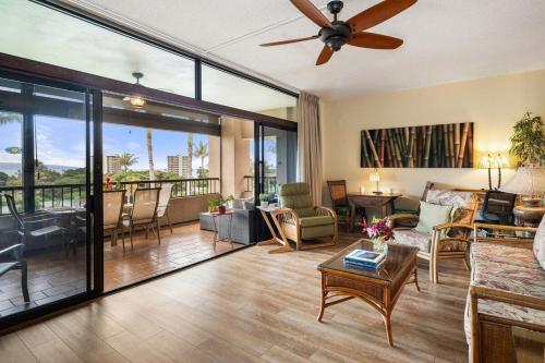 a living room with a couch and a ceiling fan at Kaanapali Royal H303 · KRL H303 Spacious 2BD Condo on Maui Golf in Lahaina