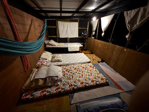 Ένα ή περισσότερα κρεβάτια σε δωμάτιο στο Lola Sayong Duwa Dwelling