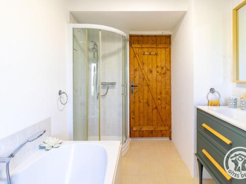a bathroom with a shower and a sink at Gîte confortable à la campagne, 2 chambres, vue dégagée - FR-1-622-118 in Le Vieil-Baugé