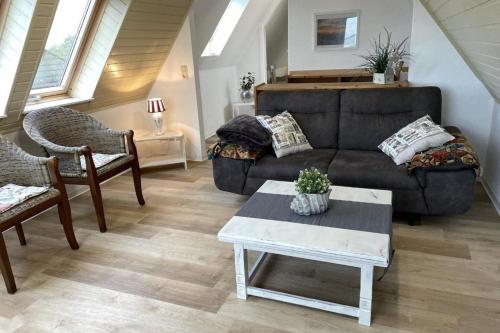 Posezení v ubytování Whg Dünenblick im Haus Wattenblick