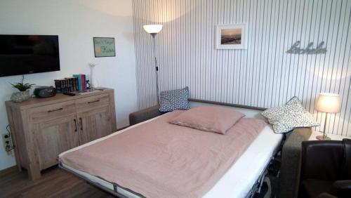 Postel nebo postele na pokoji v ubytování Appartement 1 im Haus Wattenblick