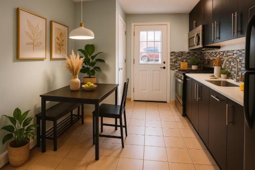 a kitchen with a table and chairs and a sink at 2 BR Apt|15 Min to NYC|Book Today in North Bergen