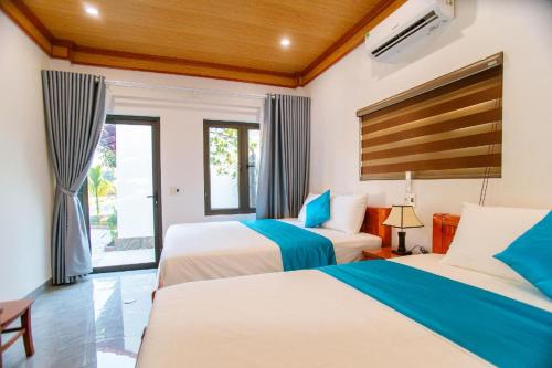 Postel nebo postele na pokoji v ubytování Tam Coc Minh Quân Homestay
