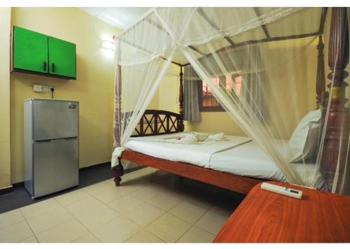 Giường trong phòng chung tại Green Villa