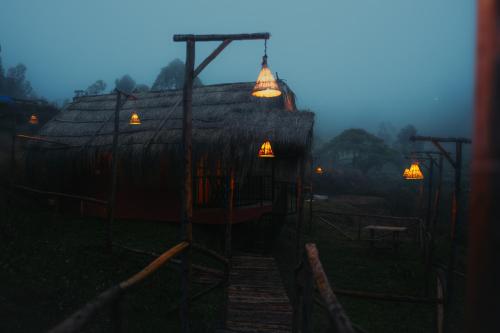 a house with lights on the side of it at Elim Retreat kanthalloor in Kanthalloor