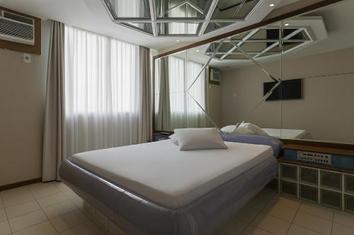 Ένα ή περισσότερα κρεβάτια σε δωμάτιο στο Motel Caricia (Adult Only)