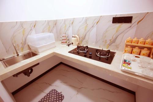 a small kitchen with a sink and a counter at White Lion Paradise Dikwella in Batigama