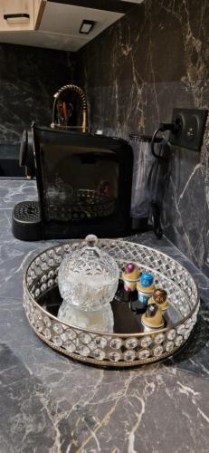 a table with a tray with a cake and cupcakes at Chic & Design Studio for 3 people in Thonon-les-Bains
