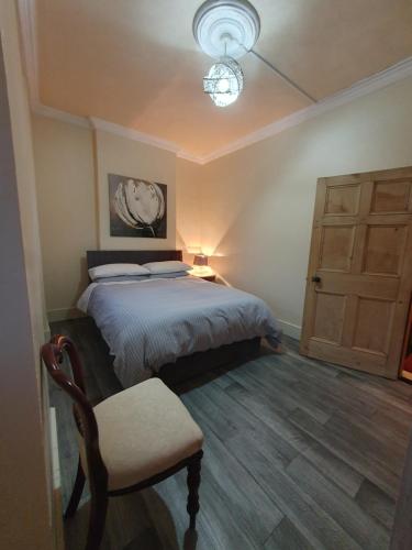 Postel nebo postele na pokoji v ubytování Petticoat House