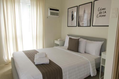 Postel nebo postele na pokoji v ubytování Verdant Villas at Eleve' Homes