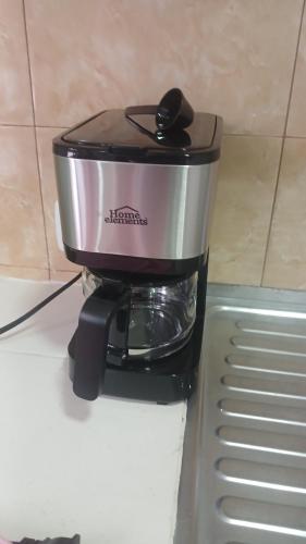 a slow cooker sitting on top of a refrigerator at Cabaña Villa Morena in Arroyo Hondo