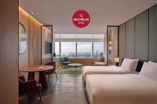 Ένα ή περισσότερα κρεβάτια σε δωμάτιο στο Park Hyatt Changsha