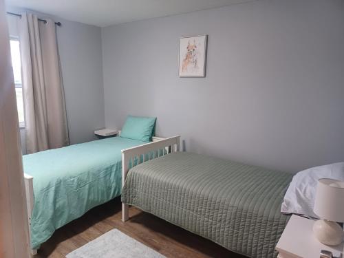 Giường trong phòng chung tại Vacation