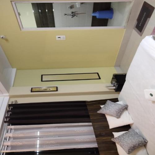 a bathroom with a sink and a mirror at Neel Pahari Homestay By StayApart in Pedong