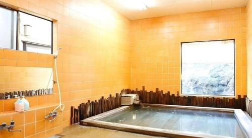 Phòng tắm tại Daitoku Hotel