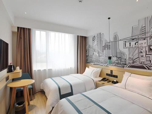 Postel nebo postele na pokoji v ubytování City Comfort Inn Jinan West Station Shandong International Convention and Exhibition