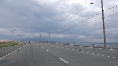 an empty road next to the ocean on a cloudy day at Ultimate Freedom Bed and Breakfast in Santa Cruz